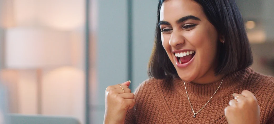 A future egg donor happy with her egg donation readiness assessment results.