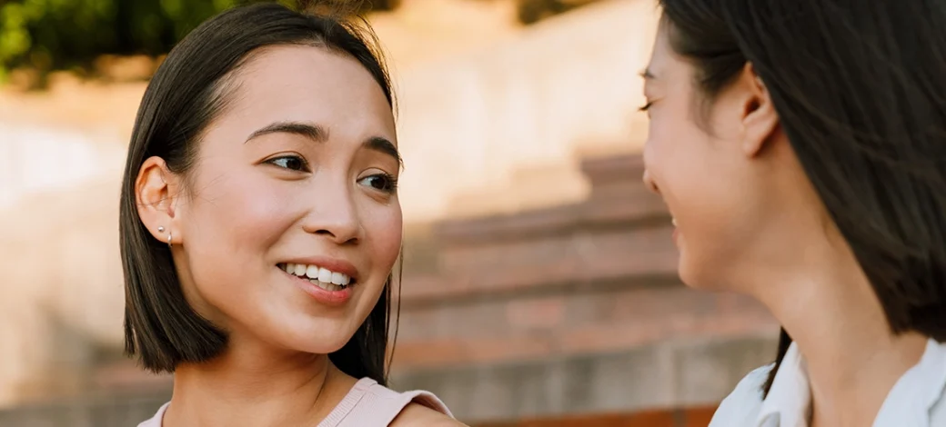 A woman talking to her friend about her egg donation experience with Fairfax EggBank.