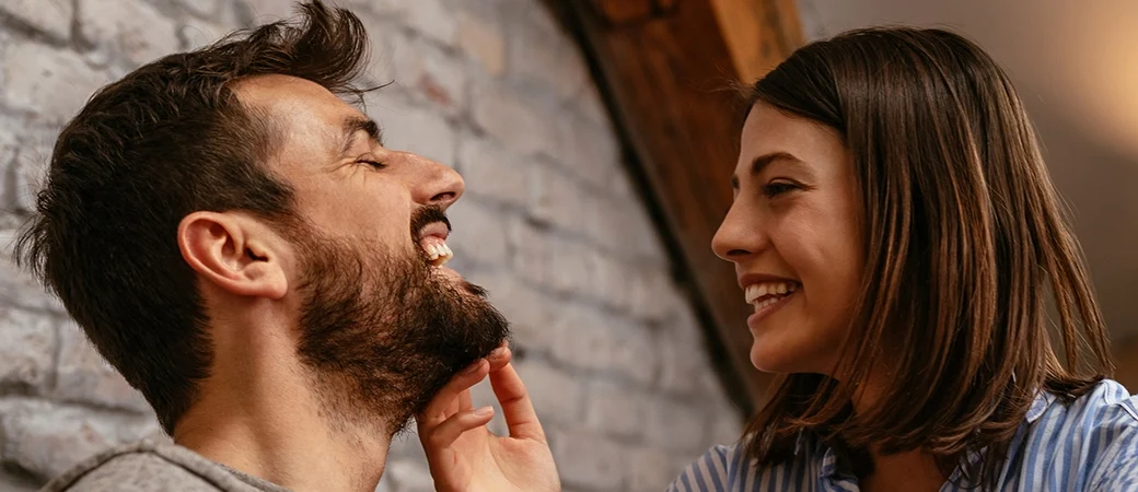 A happy couple smiling about being parents through egg donation.