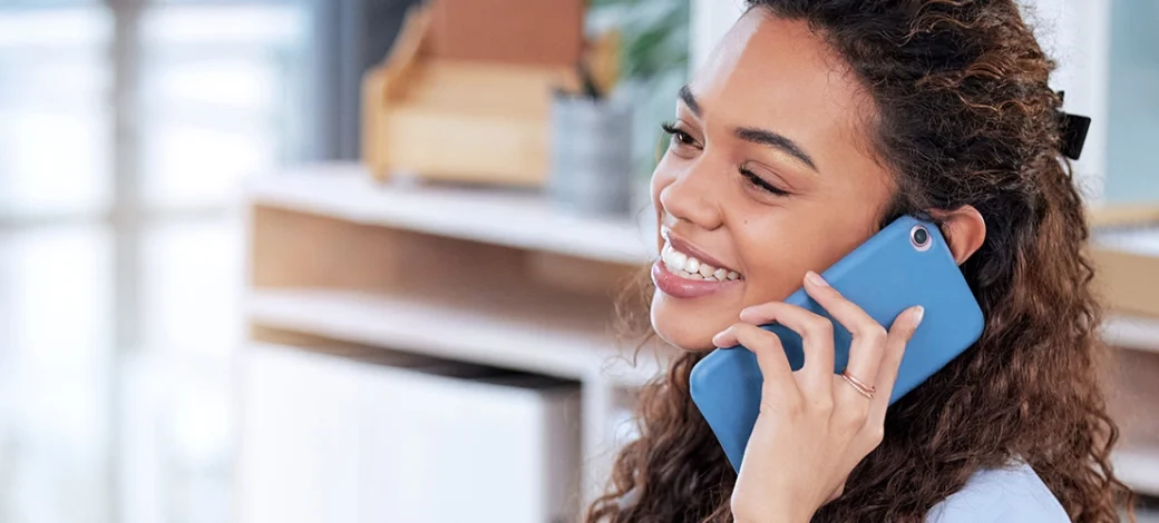 Donor egg recipient on the phone with her client relations specialist to secure her donor eggs.