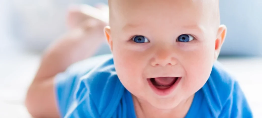 A Fairfax EggBank donor egg conceived baby smiling.