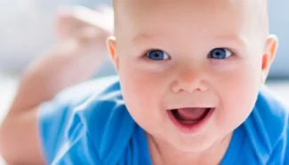 A Fairfax EggBank donor egg conceived baby smiling.
