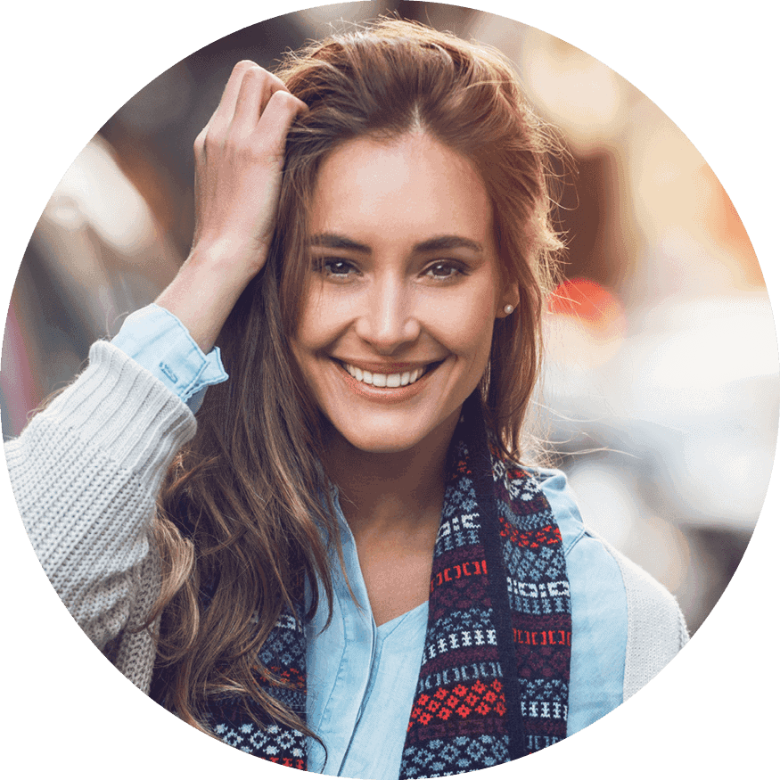 A smiling woman, looking confident and warm in her expression as an egg donor with Fairfax EggBank.