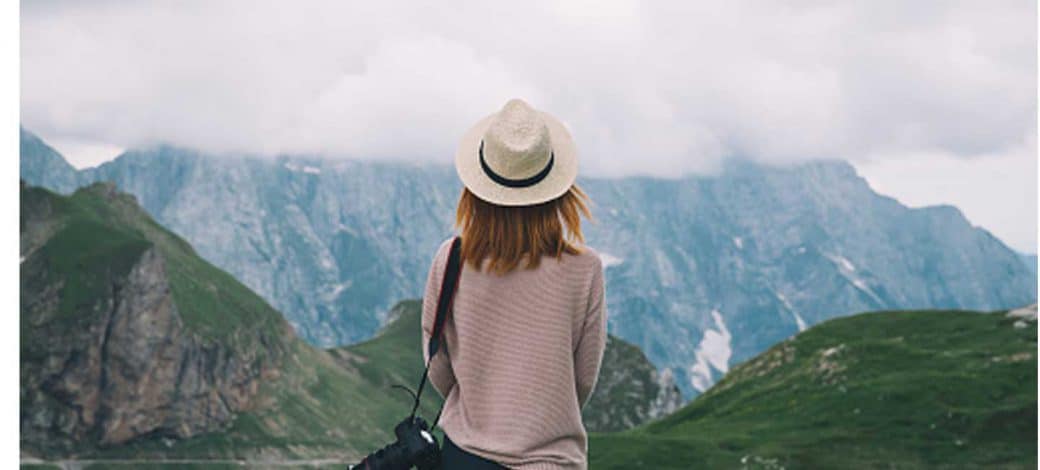 woman looks at mountains