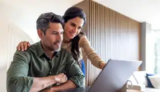 Intended parents reading through donor profiles at Fairfax EggBank