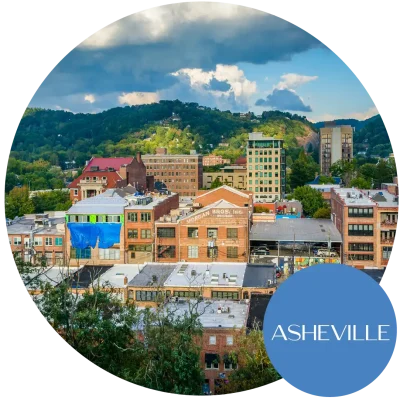 Aerial view of Asheville, NC with mountains in background. Become an egg donor in North Carolina today!